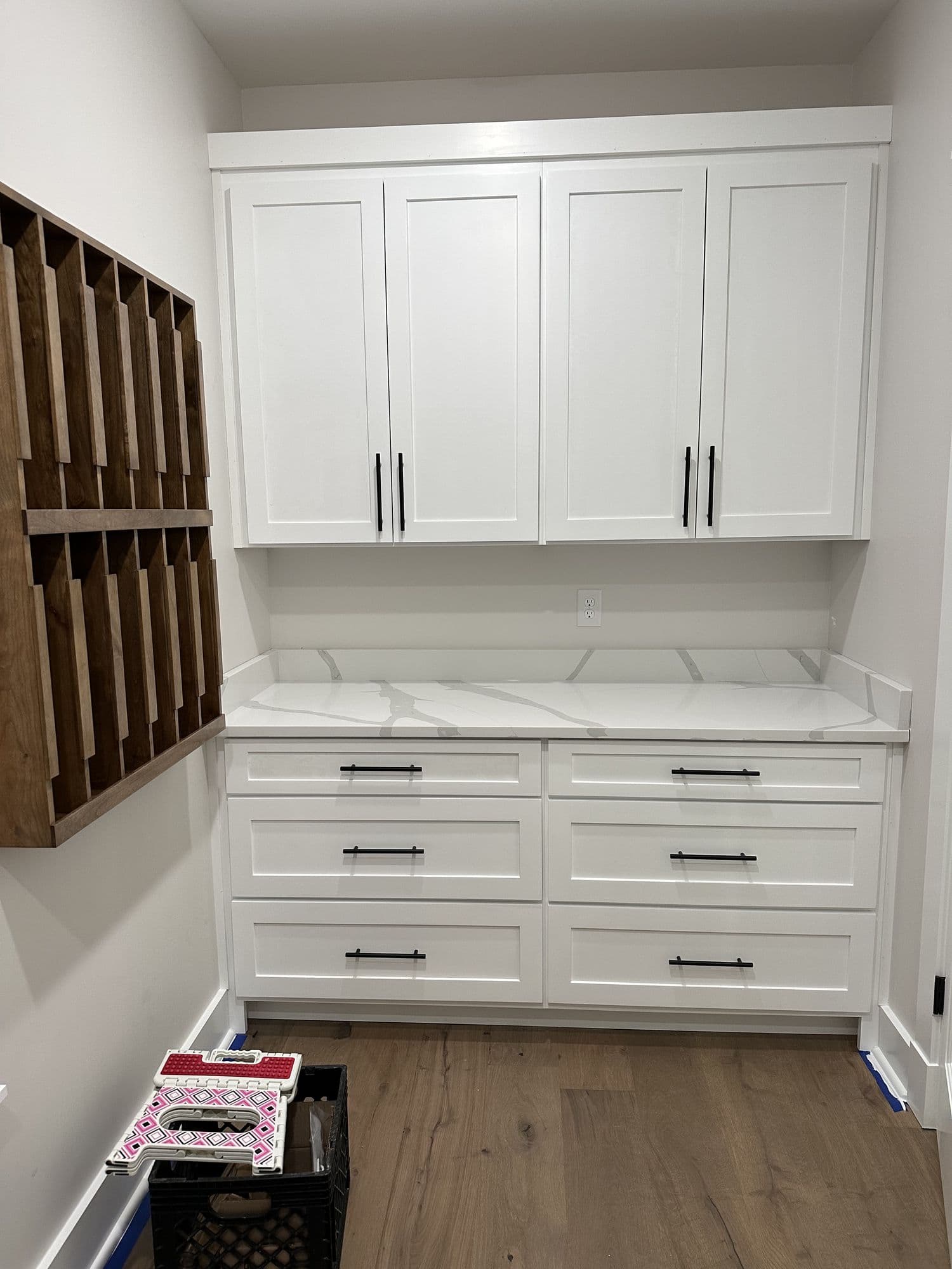 Mudroom built-ins with lockers and a stone counter
